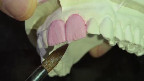 close-up-of-precise-Ceramic-crown-layering-process,-dental-laboratory