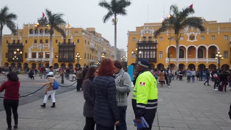 Crowd-Of-People-At-The-Historic-Plaza-Mayor-de-Lima-At-Sunset-In-Lima,-Peru