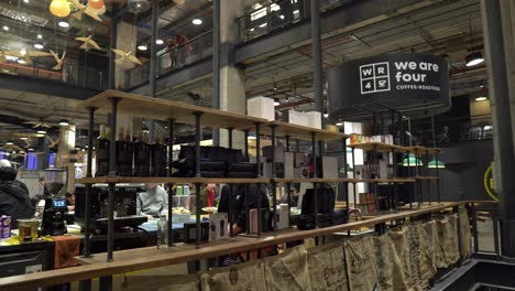 Truck-right-panoramic-of-an-exclusive-coffee-bean-stall-in-the-MUT-Tobalaba-Urban-Market-decorated-with-coffee-sacks,-rustic-decoration