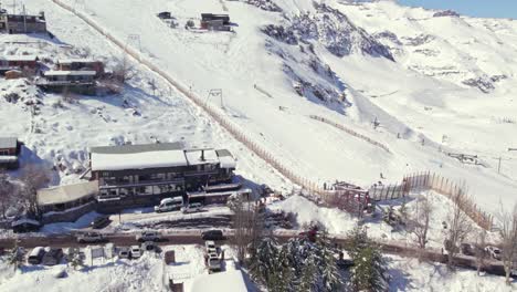Aerial-shot-of-the-busy-streets-below-the-ski-slopes-in-Farellones-after-a-snowfall