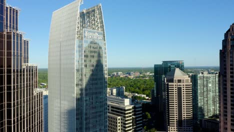 Drone-shot-moving-through-skyscrapers-in-Midtown-in-downtown-Atlanta,-Georgia