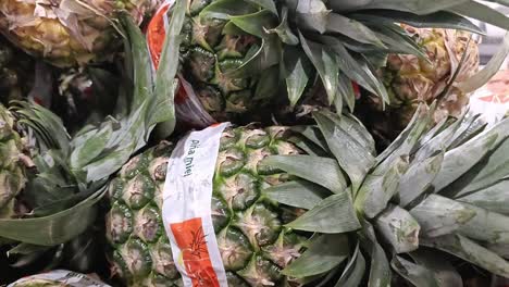 Unripe-pineapples-for-sale-in-a-supermarket