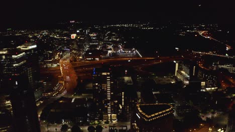 Drone-shot-slowly-flying-over-downtown-Atlanta,-Georgia-with-cars-below
