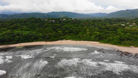 Pristine-beach-in-Playa-Guiones,-vast-Costa-Rica-landscape-backdrop