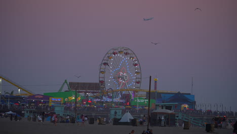 Iconic-Ferris-wheel-at-the-Santa-Monica-Pacific-Park-and-pier-amusements-in-slow-motion