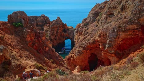 Tourists-at-the-rocky-location-of-Ponta-Da-Piedade-in-the-Algarve,-Portugal