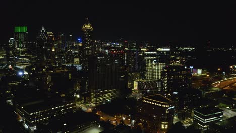 Night-shot-flying-slowly-toward-the-buildings-in-downtown-Atlanta,-Georgia