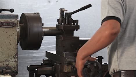 fusion-of-skill-and-machinery-as-operators-work-on-metal-parts-with-manual-drilling-machines