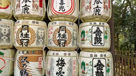 Close-up-view-of-japanese-Sake-barrels-at-a-shinto-buddhist-temple-in-Japan