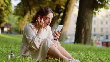Surprised-young-woman-use-smartphone-loses,-bad-news,-fortune-loss,-fail-outdoors-in-city-park