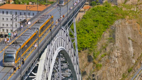 Closeup-shot-of-the-Dom-Luis-bridge-in-Porto,-showing-the-train-going-over-the-bridge