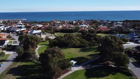 Perth-Suburb-Of-Mindarie,-Aerial-View-Over-Park-With-Ocean-Background