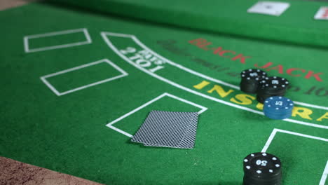Poker-player-with-a-pair-of-two-pocket-aces-in-a-casino-sitting-at-a-black-jack-table