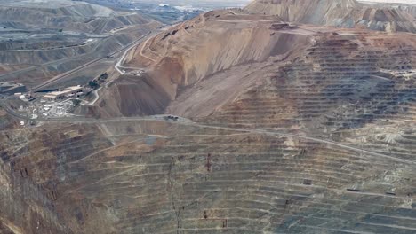 Close-up-of-Bingham-or-Kennecott-Copper-Mine-then-tilt-up-to-reveal-tailings-and-the-Salt-Lake-Valley-below