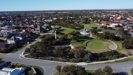 Aerial-Reverse-Shot-Of-Modern-Lighthouse,-Near-Mindarie-Marina-Perth