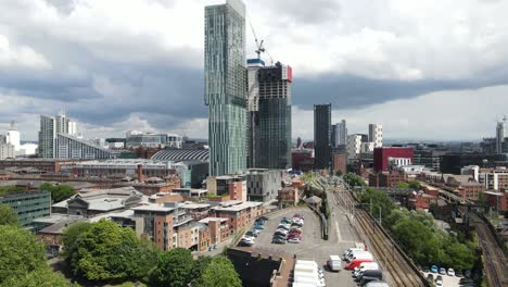 Aerial-drone-flight-revealing-a-new-skyscraper-under-construction-next-to-Beetham-Tower-in-Manchester-City-Centre