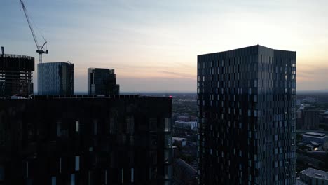 Aerial-drone-flight-over-the-North-Tower-of-Deansgate-Square-in-Manchester-City-Centre-during-the-early-evening