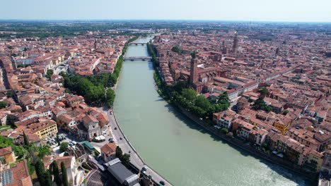 4K-Aerial-shot-of-ancient-city-center-of-Verona-with-the-Adigio-river,-Italy