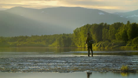 Casting-Fisherman-fishing-in-calm-waters,-Columbia-River,-Oregon