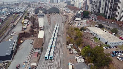 Aerial-of-two-Mitre-trains-on-tracks-by-Retiro-station-in-Buenos-Aires