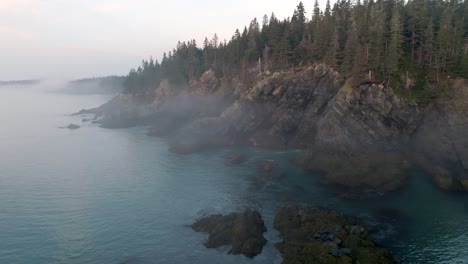 Breathtaking-Slow-Push-Through-Morning-Fog-Reveals-Maine's-Coastal-Cliffs