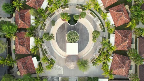 FRii-Resort-in-Gili-Trawangan,-Lombok,-Indonesia---Top-Down-Aerial-Ascending-Over-Complex-of-Small-Rental-Villas-Built-Around-Common-Circular-Lounge-Area