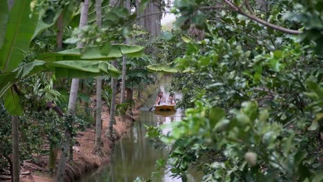 Three-Female-Tourists-Enjoying-Scenic-Boat-Ride-Through-A-Mangrove-Jungle-Forest-In-Krabi,-Thailand