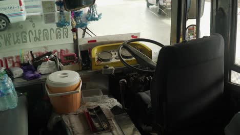 Closeup-View-Of-An-Empty-Bus-Driver-Seat-In-Bangkok,-Thailand