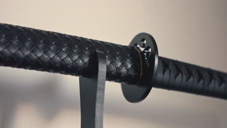 Close-up-view-of-the-black-katana-on-the-base
