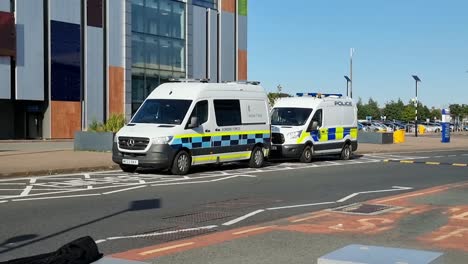 British-border-force-police-van-parked-outside-John-Lennon-airport,-Liverpool-during-asylum-seeking-crisis-control