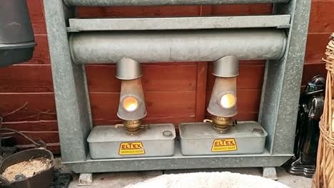 Vintage-Eltex-metal-lantern-heater-displayed-in-comfortable-retro-outdoor-home-shelter-sanctuary