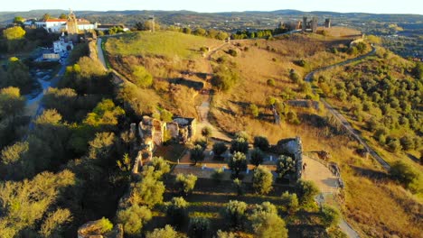 Drone-shot-of-some-old-ruins-etc-on-a-hill-in-Alentejo,-Portugal