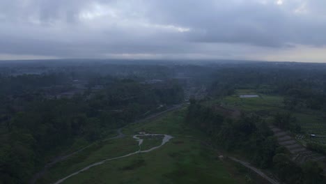 Magical-foggy-landscape-of-Indonesia-with-green-colors,-aerial-drone-view