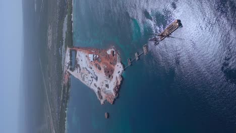 Vertical-drone-shot-of-large-construction-site-during-building-phase-of-new-port-harbor-in-Pedernales