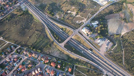 Rotating-Aerial-View-over-Highway-Exit-with-some-Traffic