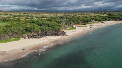 Amazing-aerial-of-shoreline-landscape-in-Hapuna-beach-Hawaii,-circle-pan