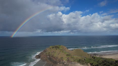 Aerial-View-Of-Norries-Headland-With-Rainbow-Over-The-Ocean-In-NSW,-Australia---drone-shot