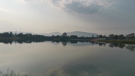 A-Pristine,-Still-Lake-Showcases-Crystal-Clarity-and-Reflects-the-Beauty-of-Its-Surrounding-Landscape-in-Thailand