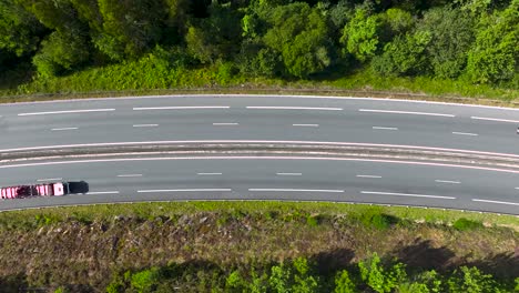 View-From-Above-Of-An-Asphalt-Road-With-Dense-Forest-Near-Padron,-Rois,-A-Coruna,-Spain