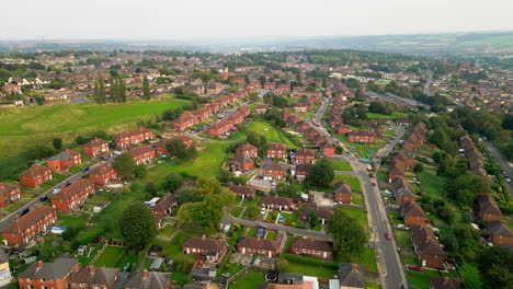 Dive-into-Dewsbury-Moore-Council-estate's-allure-through-breathtaking-drone-footage,-spotlighting-the-famous-urban-housing,-red-brick-terraced-homes,-and-the-industrial-Yorkshire-charm