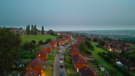 Explore-the-famed-Dewsbury-Moore-Council-estate-in-the-UK-through-drone-captured-video,-showcasing-urban-council-owned-housing,-red-brick-terraced-homes,-and-the-industrial-Yorkshire-backdrop