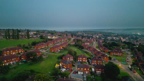 Explore-the-famed-Dewsbury-Moore-Council-estate-in-the-UK-through-drone-captured-video,-showcasing-urban-council-owned-housing,-red-brick-terraced-homes,-and-the-industrial-Yorkshire-backdrop