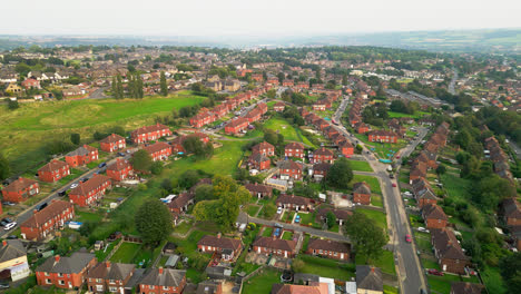 Dive-into-Dewsbury-Moore-Council-estate's-allure-through-breathtaking-drone-footage,-spotlighting-the-famous-urban-housing,-red-brick-terraced-homes,-and-the-industrial-Yorkshire-charm