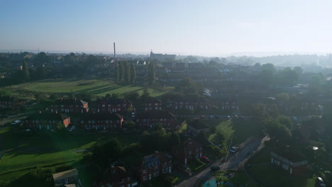Explore-Dewsbury-Moore-Council-estate-in-the-UK-via-drone-footage,-revealing-red-brick-housing-and-the-Yorkshire-industrial-landscape-on-a-sunny-summer-day