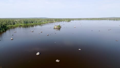 Aerial-View-Captures-Majestic-Rocky-Lake-in-Remote-Canadian-Wilderness