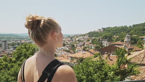 Travel-hungry-tourist-overlooks-historic-city-of-Veliko-Tarnovo-Bulgaria