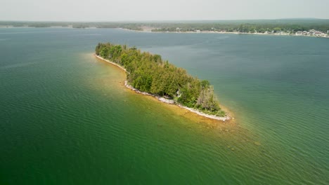 Aerial-orbit-around-Haven-Island,-Les-Cheneaux-Islands,-Michigan