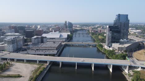 Downtown-Grand-Rapids-along-the-Grand-River-in-Michigan,-aerial-drone-view