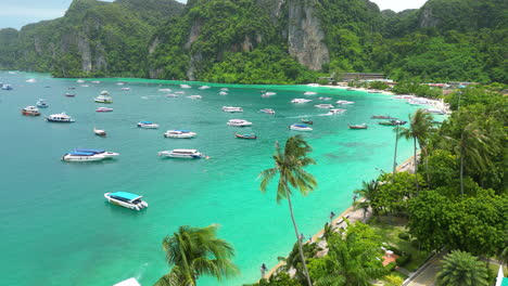 Leisure-boats-anchored-in-exotic-Tonsai-Bay,-Koh-Phi-Phi,-Thailand