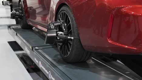 Wheel-balancing-and-alignment-equipment-on-a-car-wheel-at-a-repair-shop,-Luxury-car-wheel-balancing-and-alignment